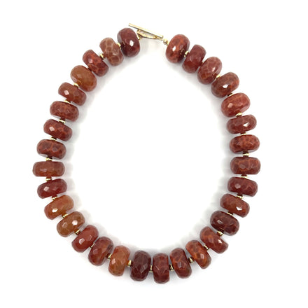 Elegant fire agate choker by rraine featuring faceted fire agate beads and a gold-filled clasp, measuring 16 inches in length.