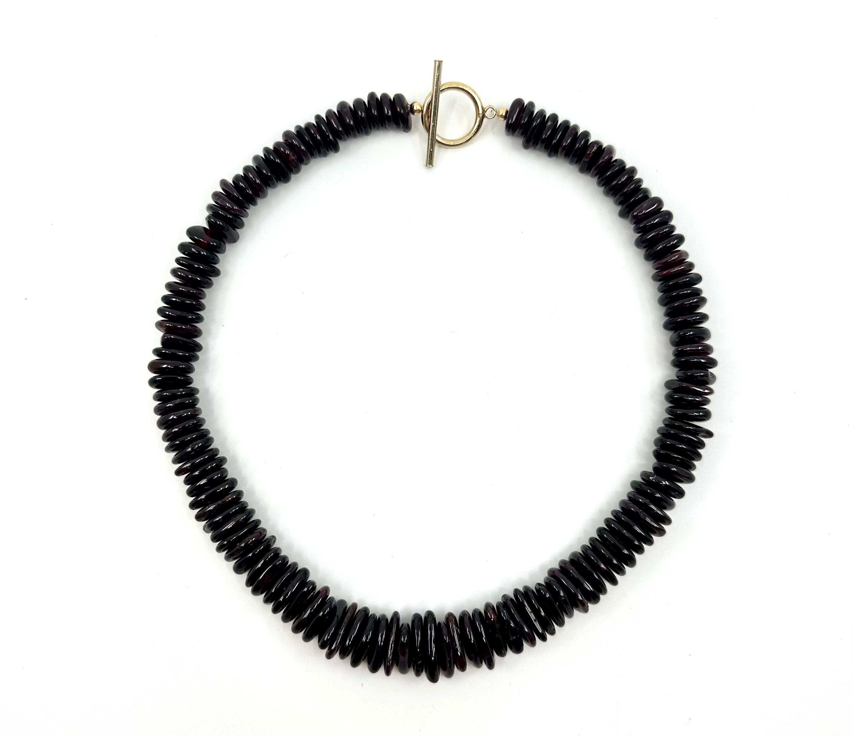 Elegant garnet choker by rraine featuring rich garnet beads and a gold-filled clasp, measuring 15 inches in length