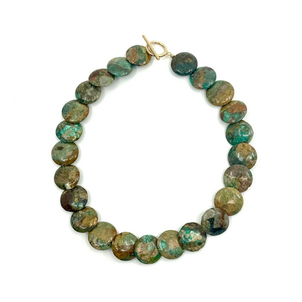 Turquoise choker with a 15.5'' gold-filled clasp, featuring polished turquoise beads.