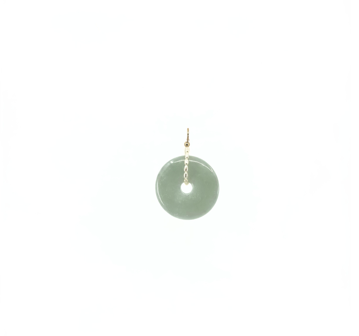 Elegant jade and pearl pendant by rraine featuring a gold-filled detail, measuring 35mm. Ideal for pairing with the thin pearl choker.