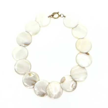 Shell choker by rraine featuring large shell beads and a gold-filled clasp, measuring 16.5 inches in length.