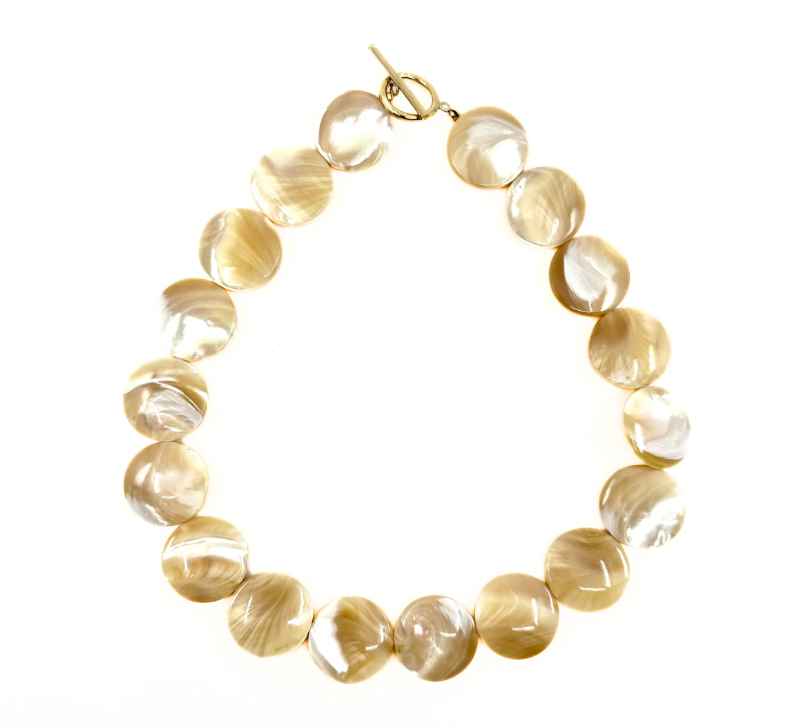 Small shell choker with a 15'' gold-filled clasp, featuring round, polished shell beads.